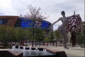 Bliss Dance, a statue by Marco Cochrane, is surrounded by fountains and trees in front of the new T-Mobile Arena.